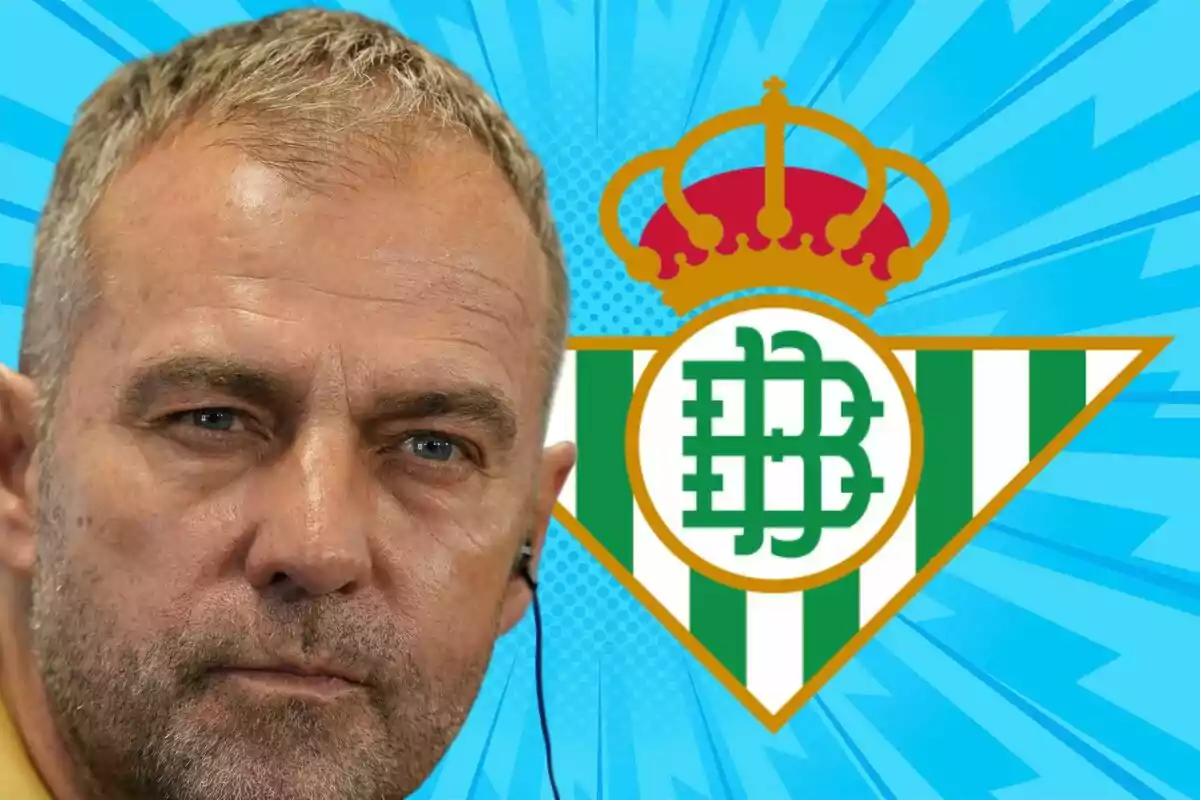Hombre de cabello corto y canoso con auricular en la oreja frente al escudo del Real Betis sobre un fondo azul llamativo