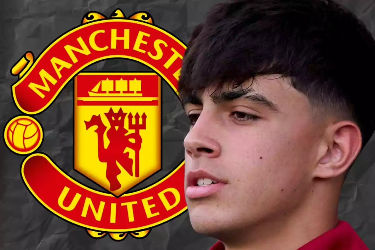 Young man with dark hair in front of the Manchester United crest