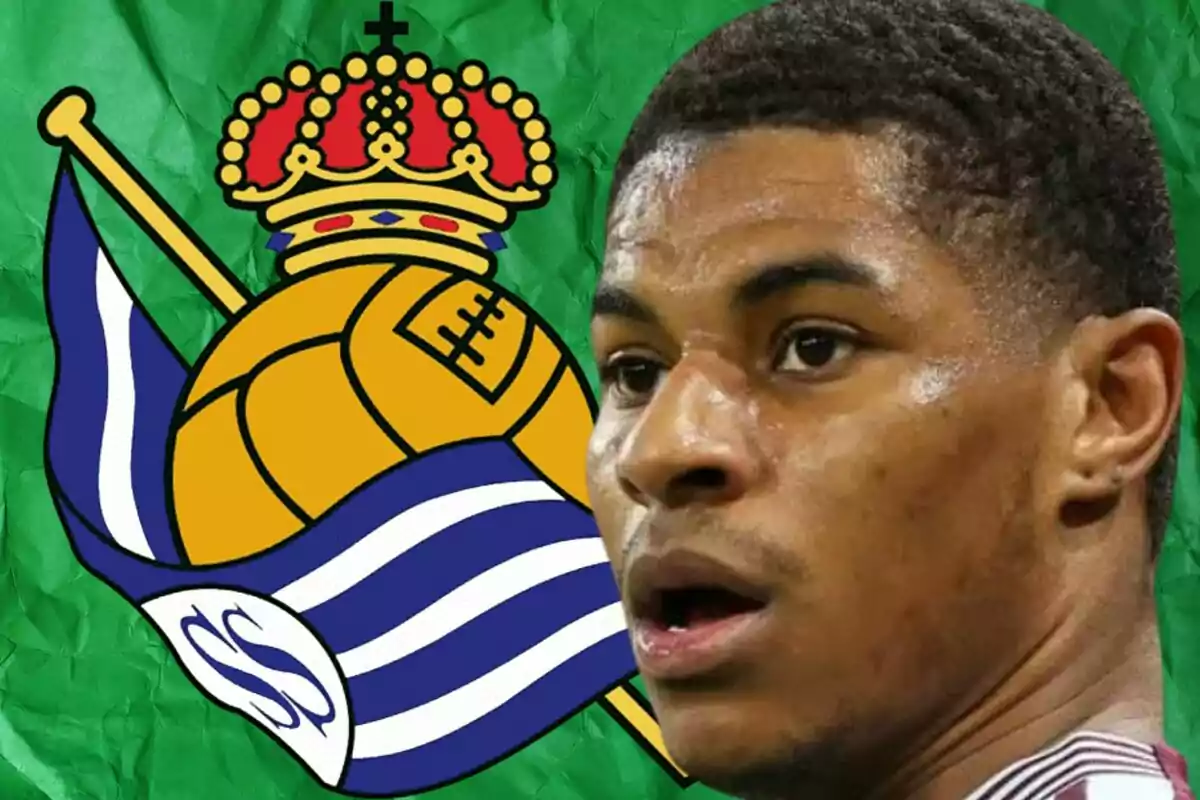 A player with a serious expression appears in the foreground against a background featuring the Real Sociedad crest.