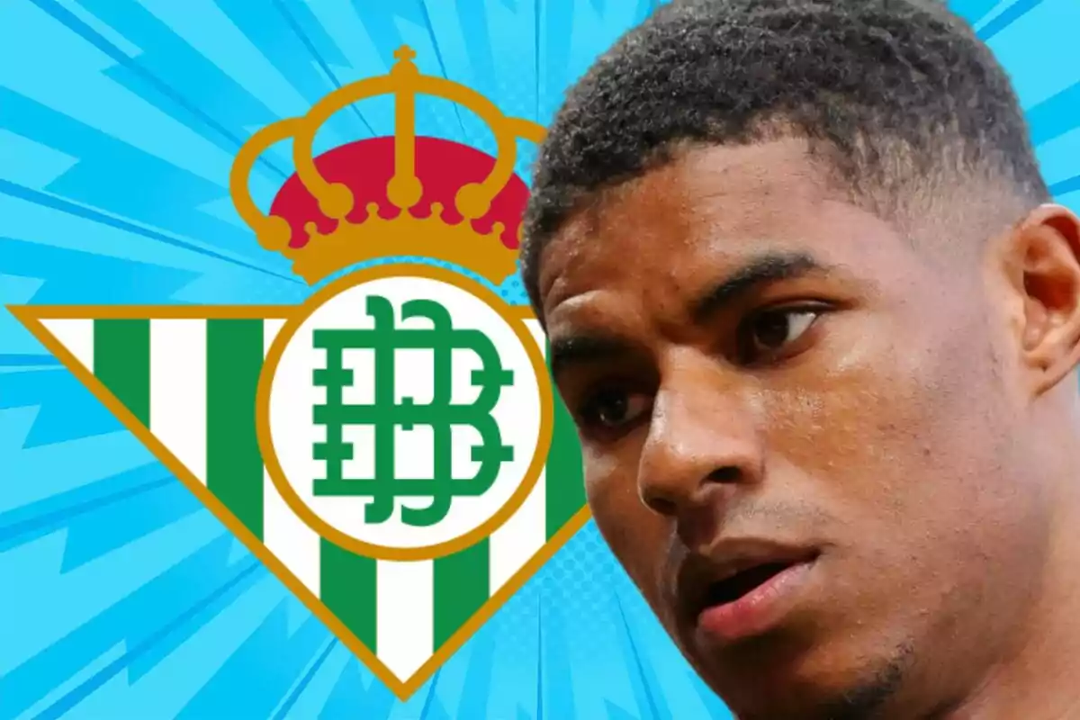 A player in the foreground with the Real Betis crest in the background on a striking blue design