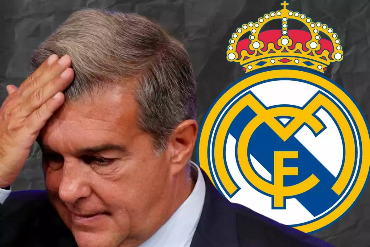 Man with a worried expression touching his head in front of the Real Madrid crest