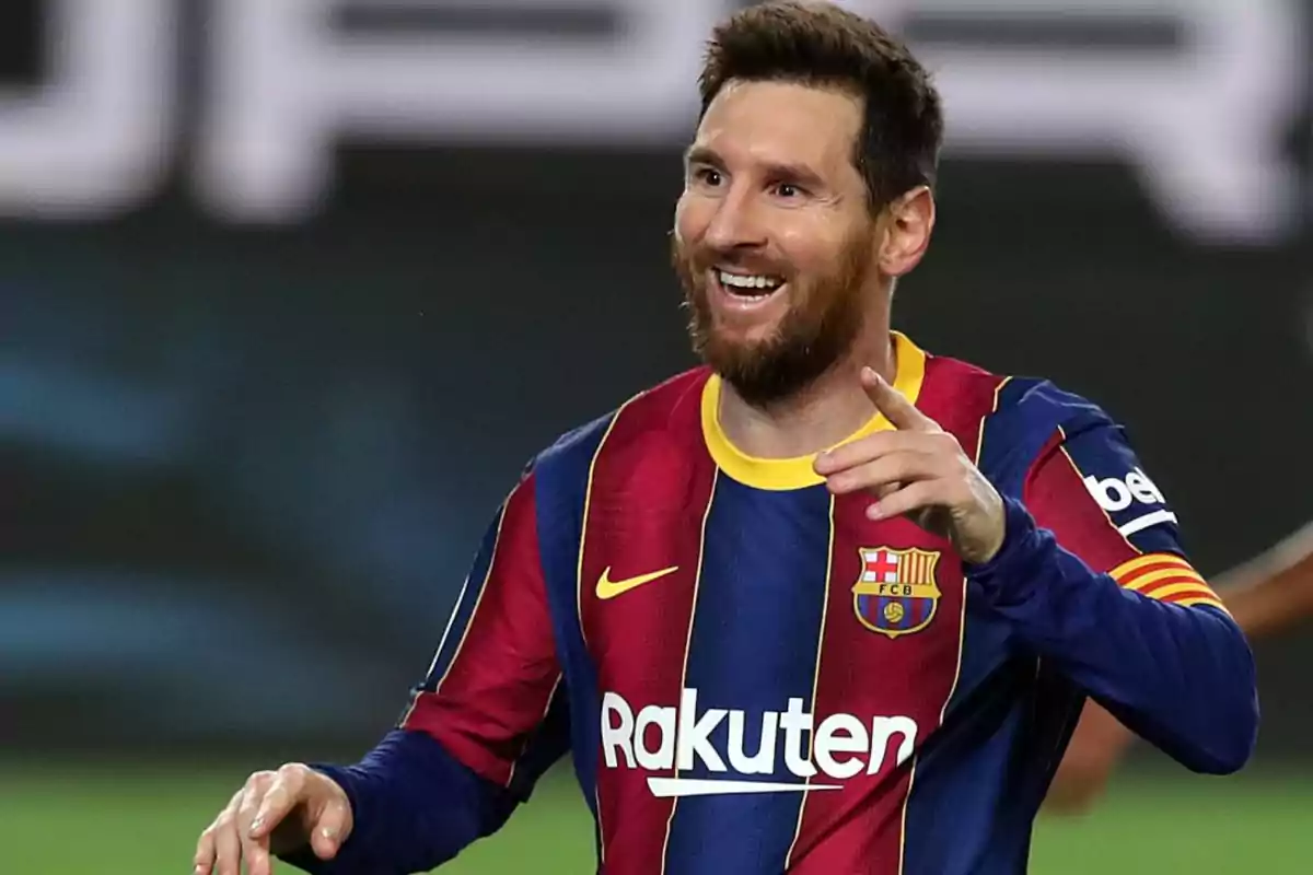 Soccer player in FC Barcelona uniform celebrating on the field