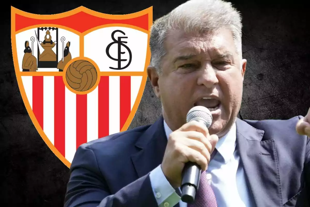 A man speaking into a microphone with the Sevilla FC crest in the background.