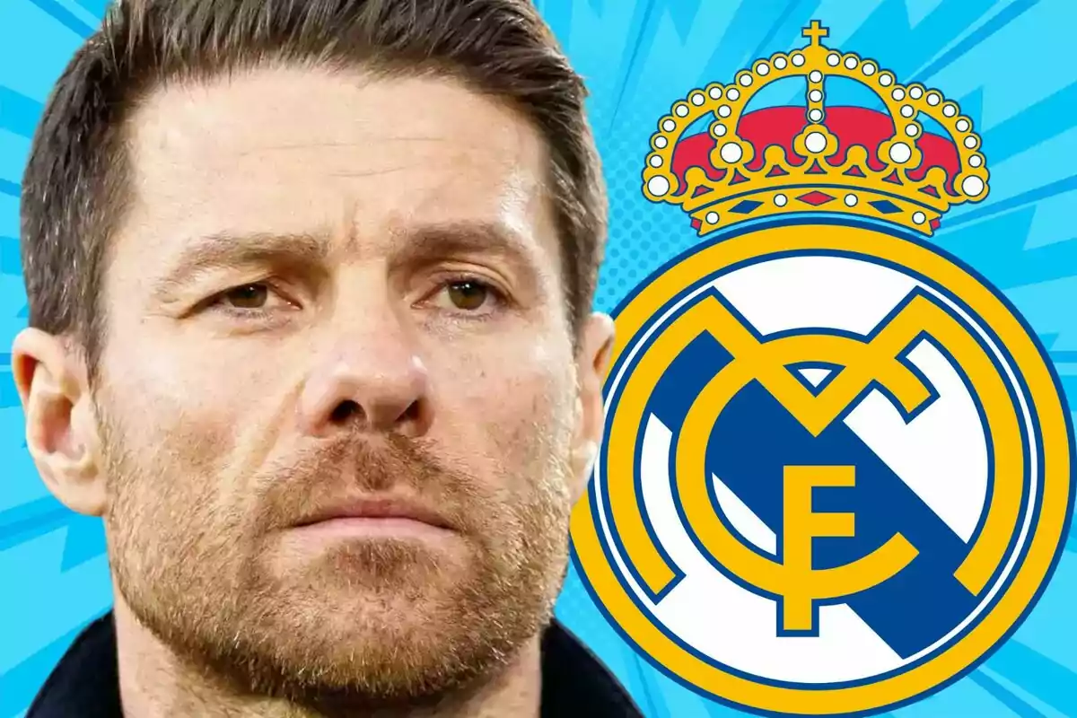 Hombre de cabello corto y barba frente al escudo del Real Madrid sobre un fondo azul