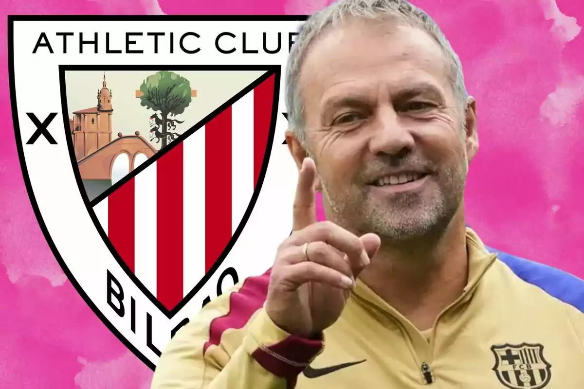 Un hombre sonriente con una chaqueta deportiva frente al escudo del Athletic Club de Bilbao sobre un fondo rosa.