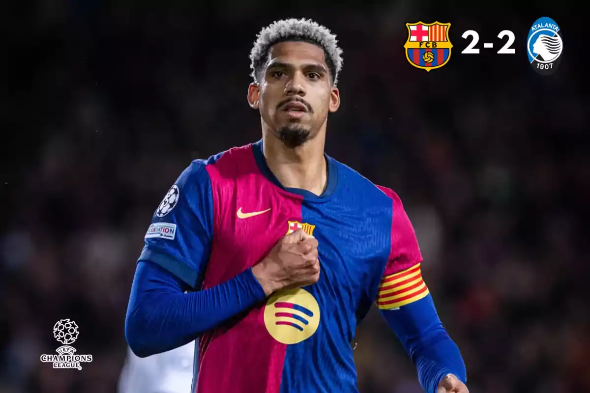 A player in the FC Barcelona uniform holds his jersey with his fist while wearing a captain's armband, the scoreboard shows a 2-2 draw against Atalanta in a UEFA Champions League match.