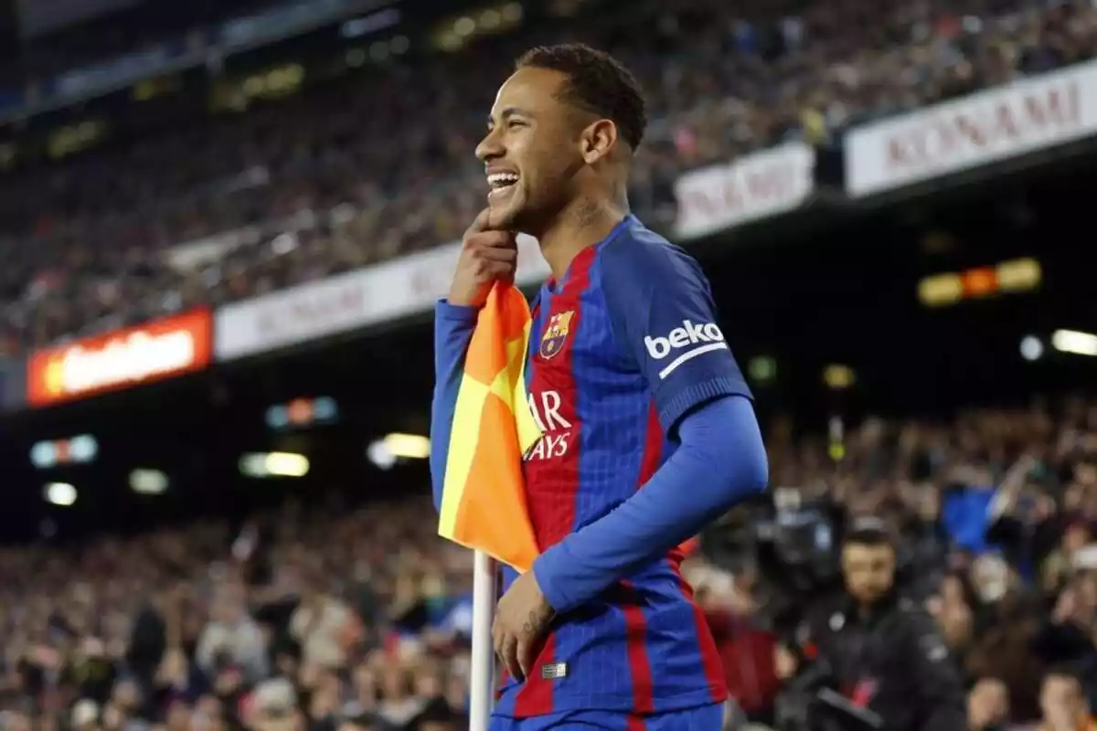 Neymar, with the FC Barcelona shirt, leaning on a corner flag