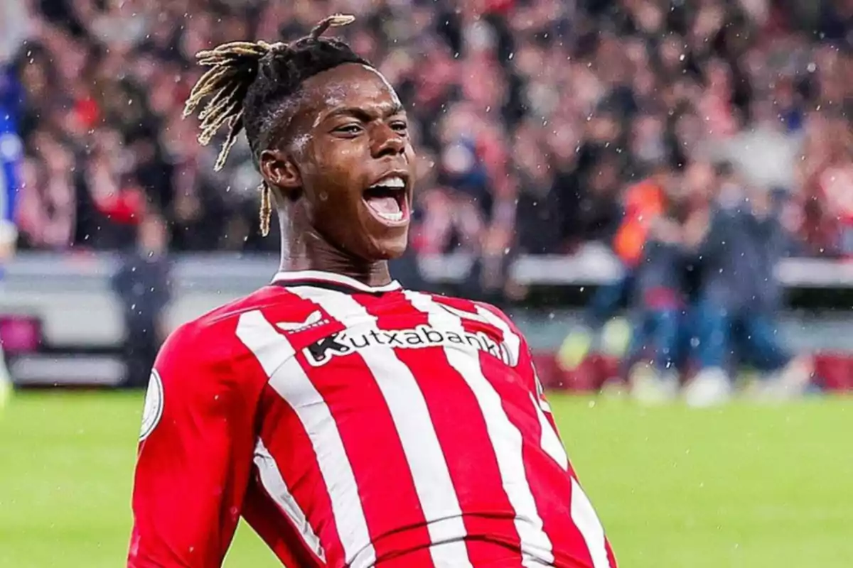 Soccer player celebrating a goal with the Athletic Club de Bilbao shirt.