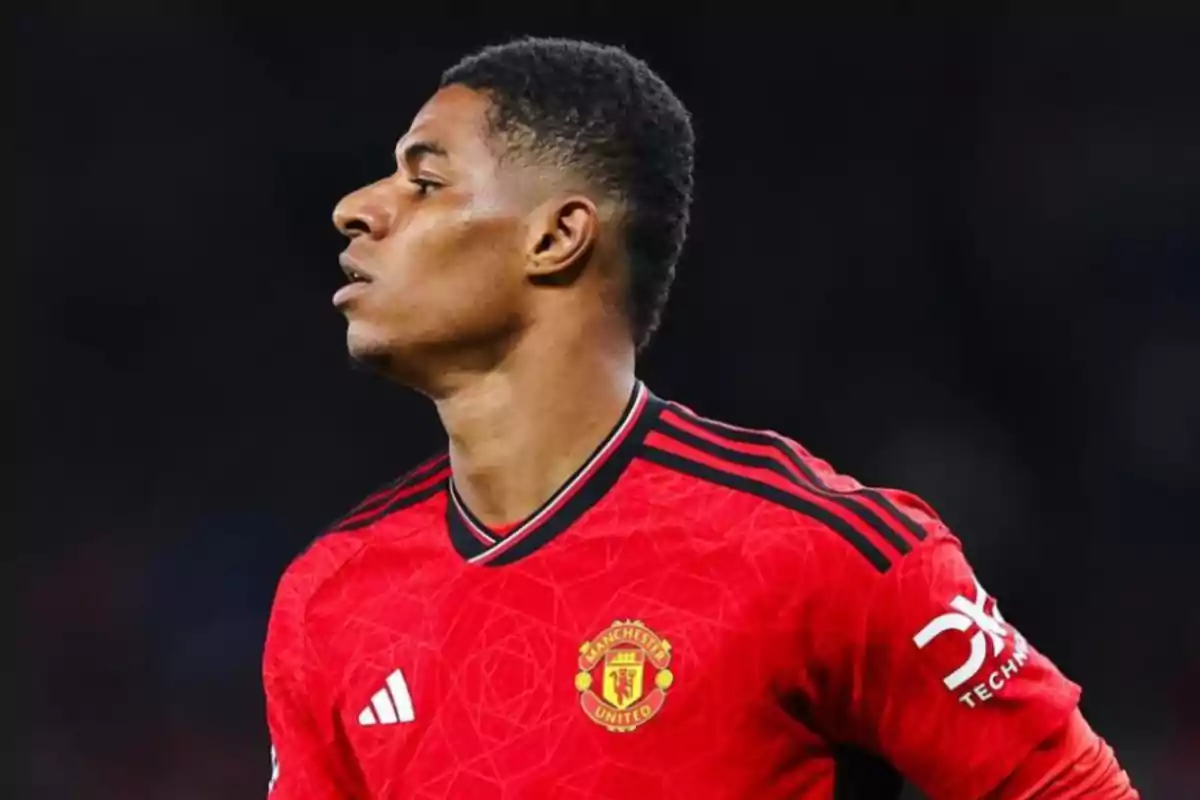 Football player in a red Manchester United shirt at a match.